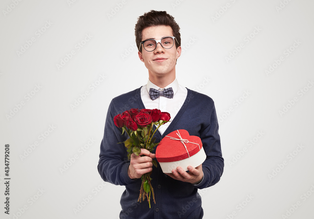 Romantic man with bouquet of flowers and gift Romantic man with bouquet of flowers and gift