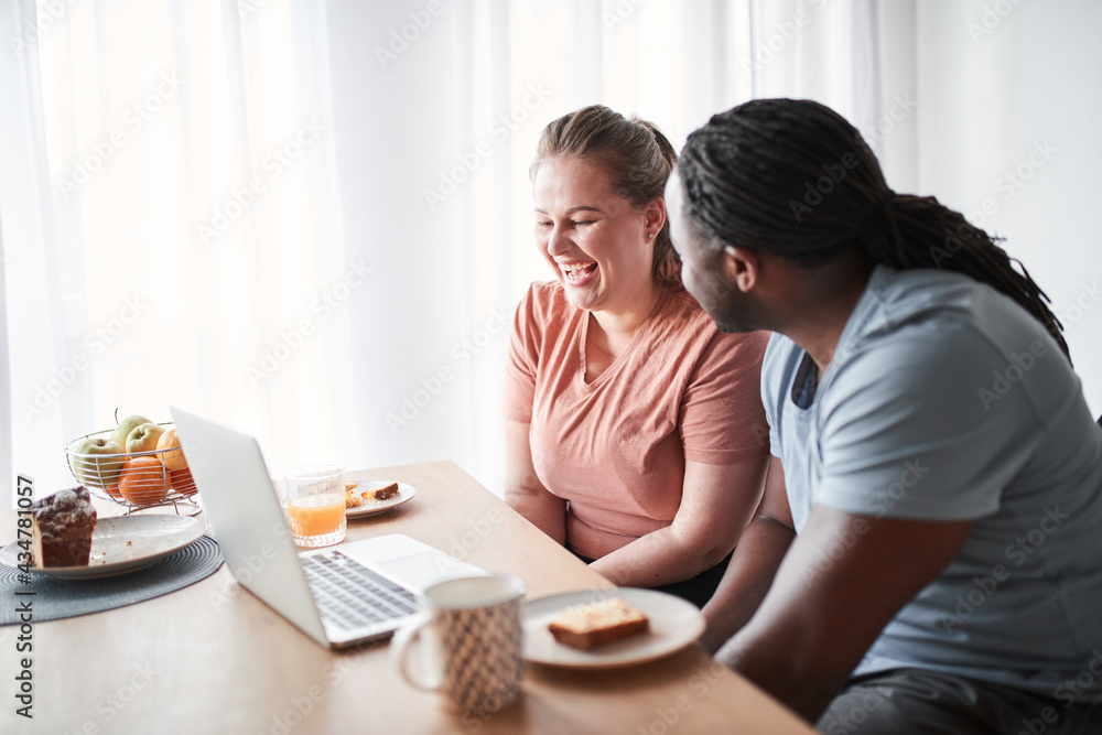 Couple feeling relieved and rested while having breakfast together Couple feeling relieved and rested while having breakfast together