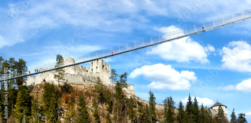 Persons walking across the Highline179 (Hängebrücke Ehrenberg) a pedestrian suspension bridge near the Bavarian-Austrian Border, above the Ehrenburg castle photo