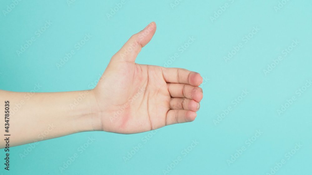 Empty Hand holding or catch nothing guesture on mint green or ttiffany blue background. Empty Hand holding or catch nothing guesture on mint green or ttiffany blue background.