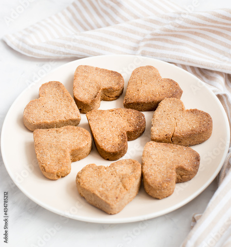 homemade heart-shaped cookies on a plate, Valentine's day gift with love, gluten-free buckwheat flour pastries