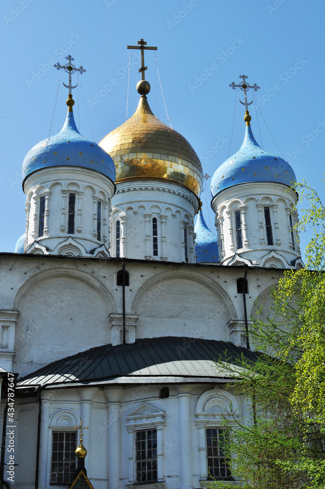 The domes of the cathedral are blue and gold. Domes against a cloudless sky, Architecture, religion.