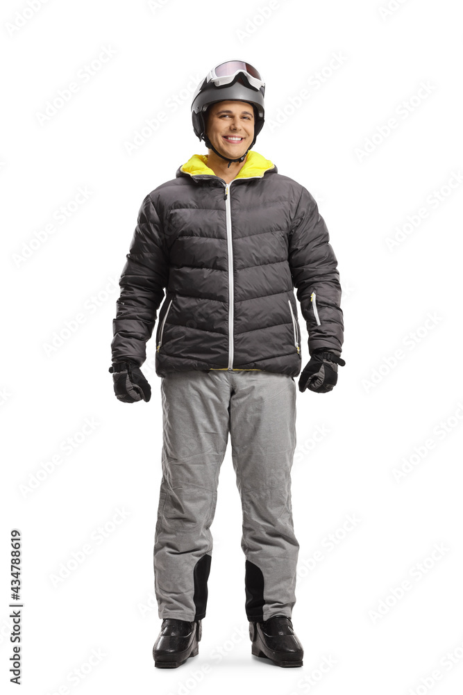Full length portrait of a young man wearing a ski helmet and boots Full length portrait of a young man wearing a ski helmet and boots