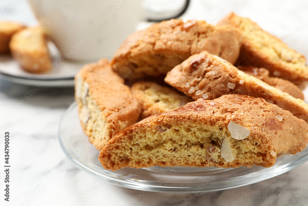 Traditional Italian almond biscuits (Cantucci) on white table, closeup