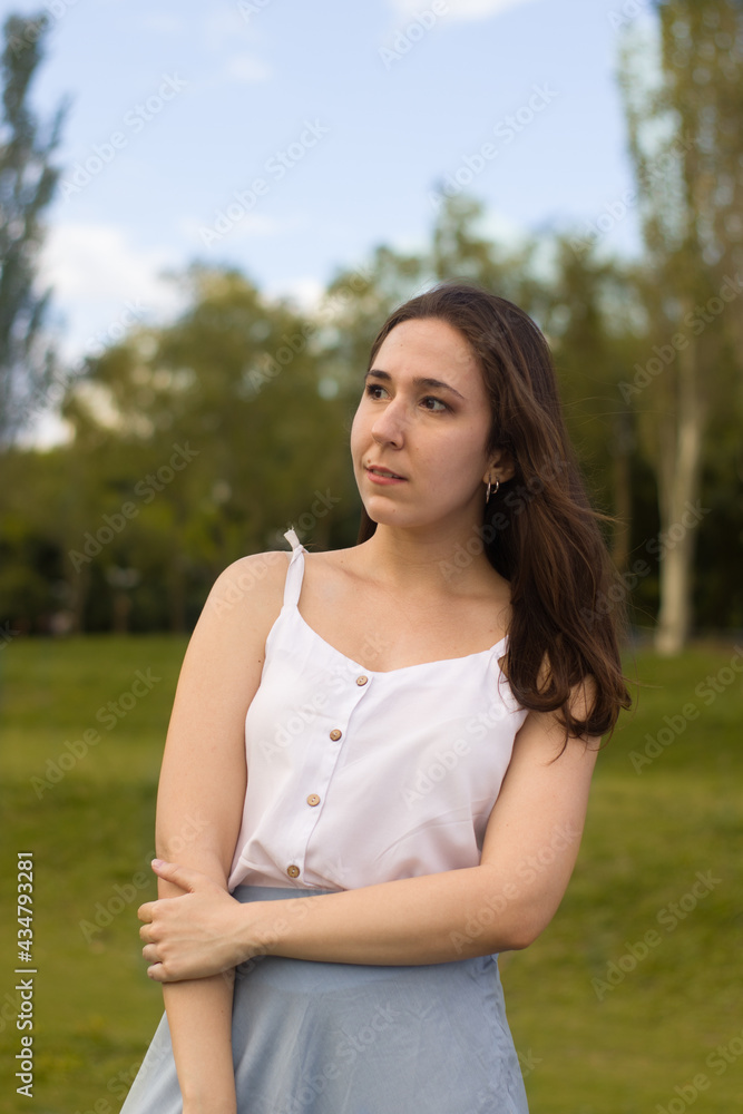 Young woman portrait at the park. Young woman portrait at the park.