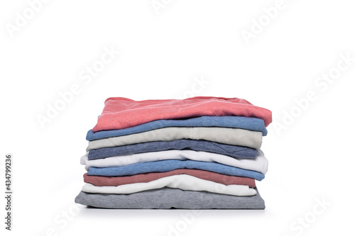 Stack of folded tshirts on white background