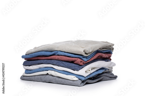 Stack of male tshirts on white background