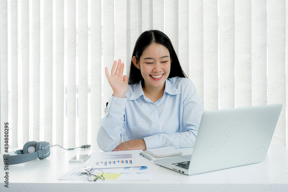 Businesswoman analysis the chart and meeting Video Conferencing with laptop at the home office for setting challenging business goals And planning to achieve the new target