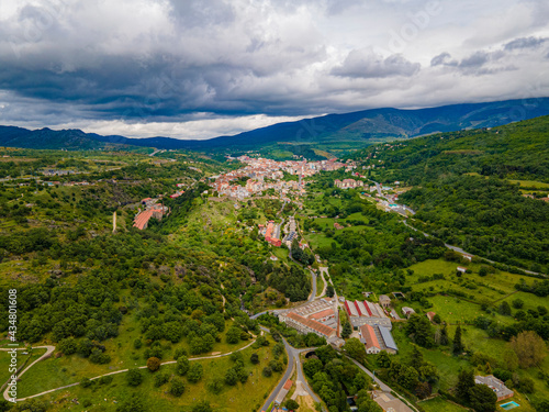 Candelario en la provincia de Salamanca desde el cielo con vistas de un drone, con el campo verde y día soleado con nubes photo