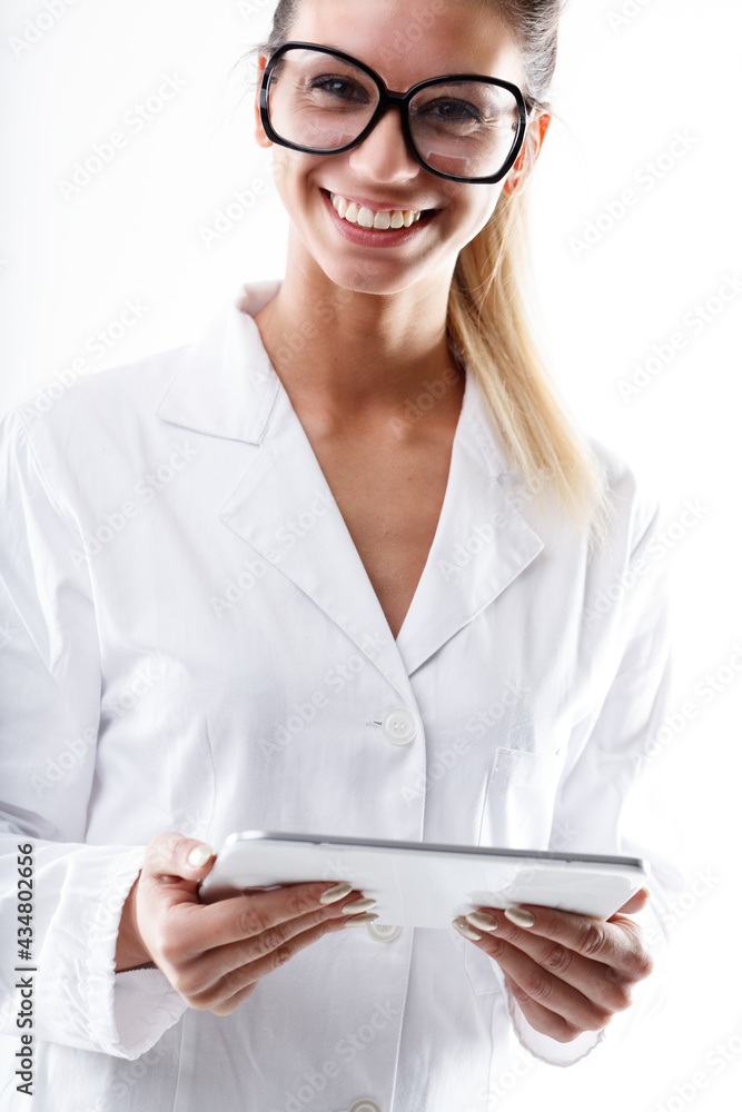 Studio portrait of a happy nurse or doctor holding a PC Tablet Studio portrait of a happy nurse or doctor holding a PC Tablet