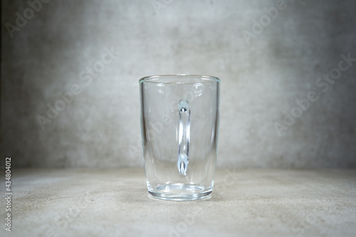 Empty glass cup that looks like a simple glass. 