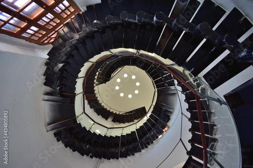 A spiral staircase in an old water tower photo