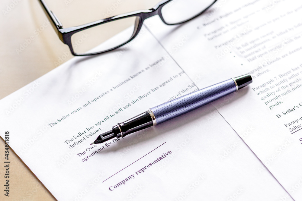 office desk with signing contract, glasses and pen for business office desk with signing contract, glasses and pen for business