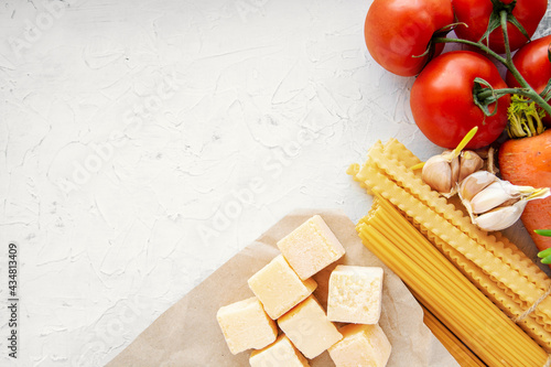 composition of raw pasta and spaghetti different shapes, frame of raw pasta. room for text	
