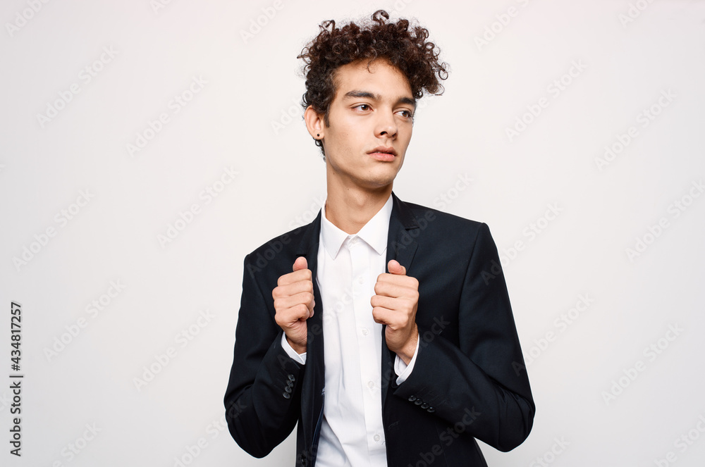 guy with curly hair in a suit fashion black blazer modern style guy with curly hair in a suit fashion black blazer modern style