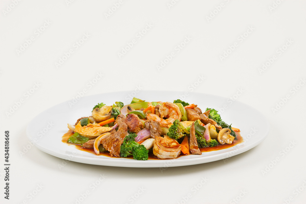 Chinese food with meat, shrimps and vegetables. Chinese food with meat, shrimps and vegetables.