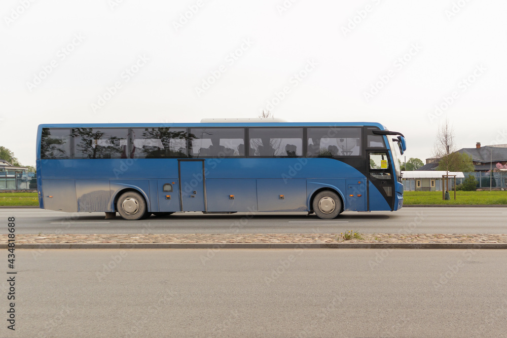 Blue intercity bus on the street