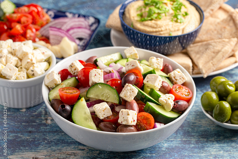 Bowl of Fresh Greek Salad with Cucumbers Tomatoes Olives and Feta Cheese