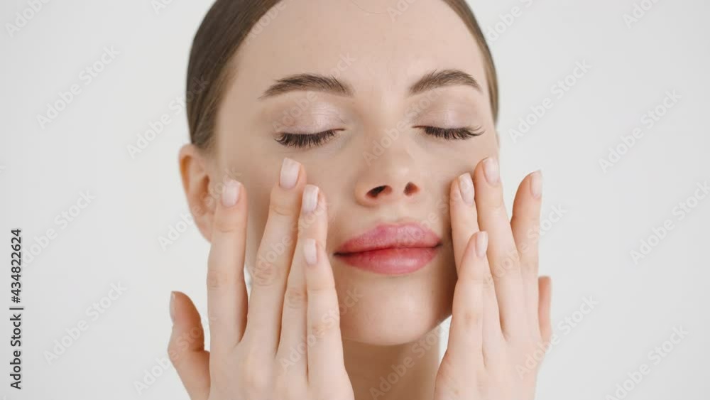 Beauty woman face healthy skin massage hands touching face clean skin beauty female close up Beauty woman face healthy skin massage hands touching face clean skin beauty female close up