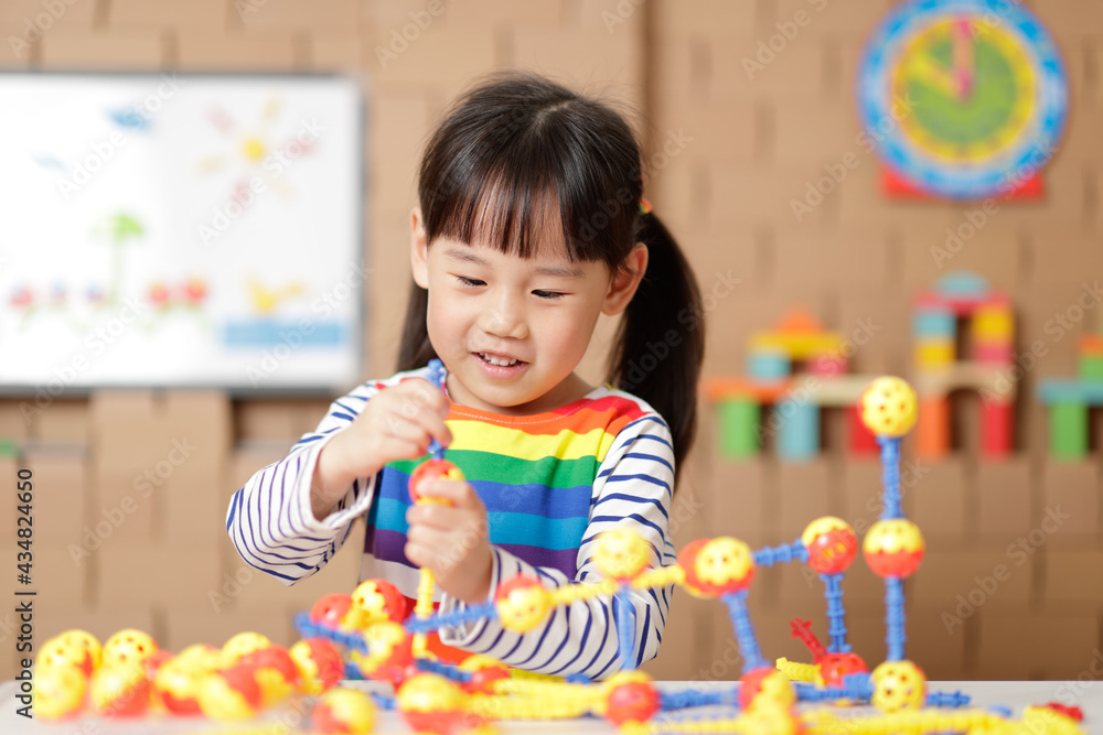 young irl playing creative toy blocks at home young irl playing creative toy blocks at home
