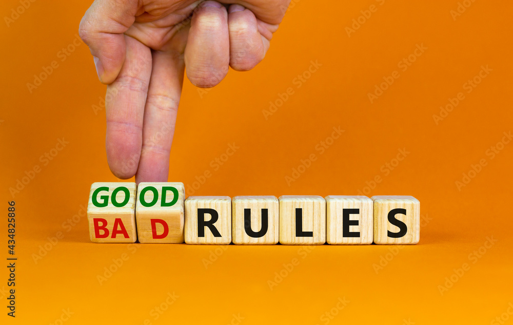 Foto Stock Good or bad rules symbol. Businessman turns wooden cubes and ...