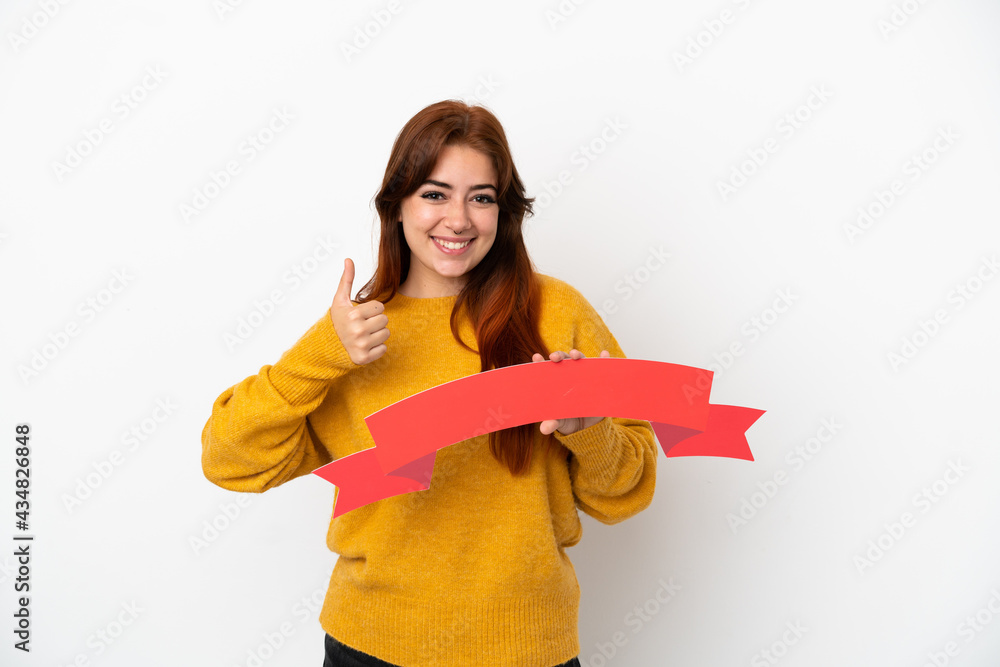 Young redhead woman isolated on white background holding an empty placard with thumb up Young redhead woman isolated on white background holding an empty placard with thumb up