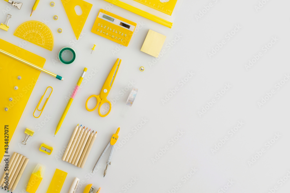 School stationery on a grey background. Top view. Flat lay. Back to school concept.