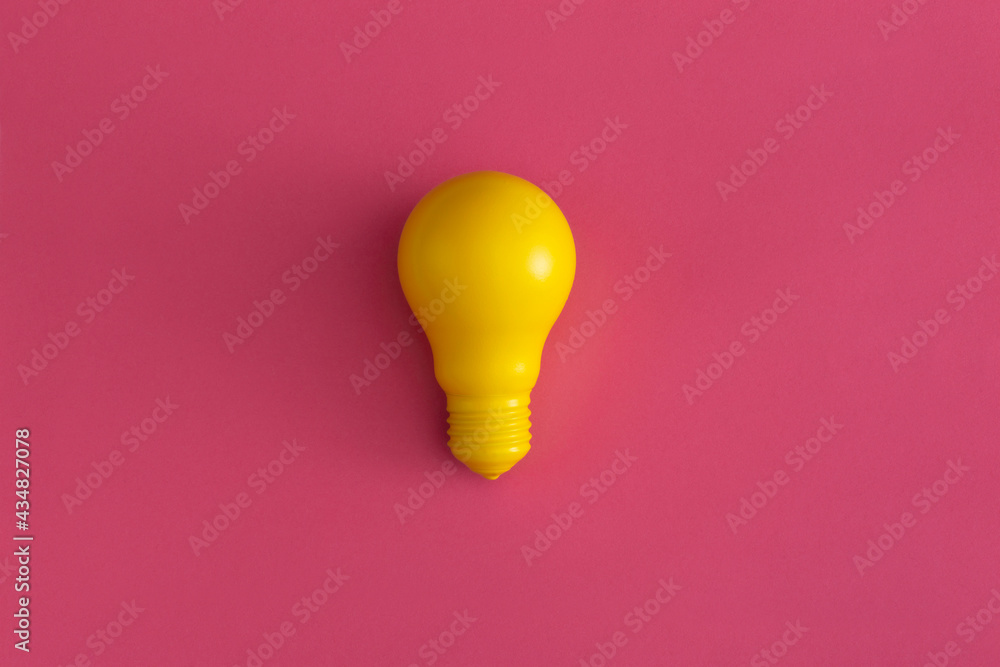 Light bulb on pink background. Inspiration and creative idea concept. Top view with copy space. Flat lay composition. Light bulb on pink background. Inspiration and creative idea concept. Top view with copy space. Flat lay composition.