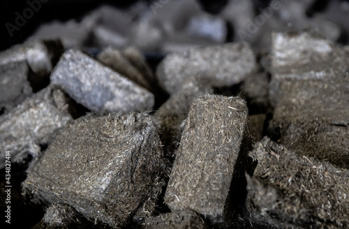 A lot of fuel briquettes from pressed sawdust. Briquettes for the oven close-up.