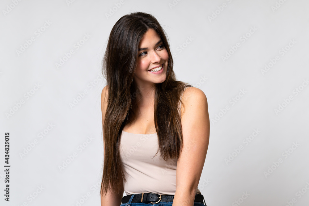 Teenager Brazilian girl over isolated background Teenager Brazilian girl over isolated background
