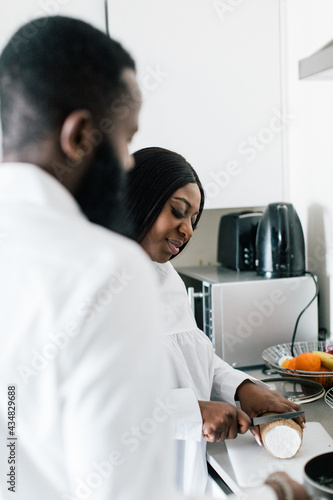 Husband and wife cooking together in the kitchen