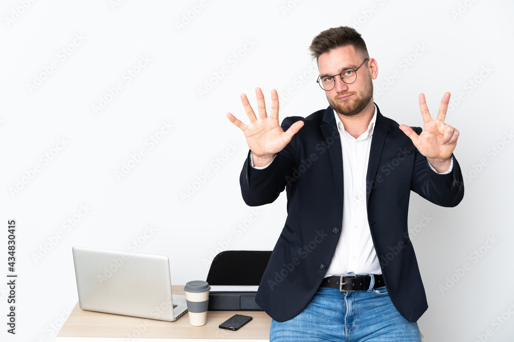 Russian man in a office isolated on white background counting eight with fingers Russian man in a office isolated on white background counting eight with fingers