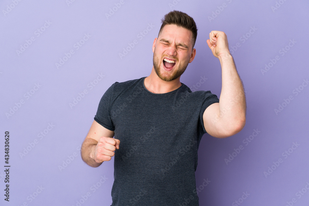 Russian handsome man over isolated background celebrating a victory Russian handsome man over isolated background celebrating a victory