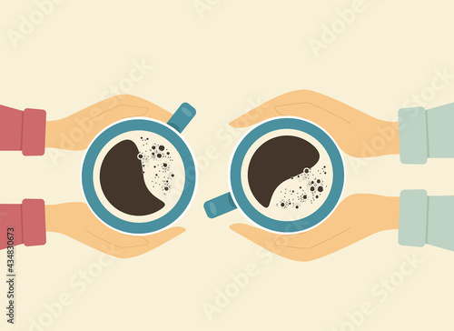 The concept of a romantic meeting over coffee. Male and female hands hold cups with coffee. View from above.