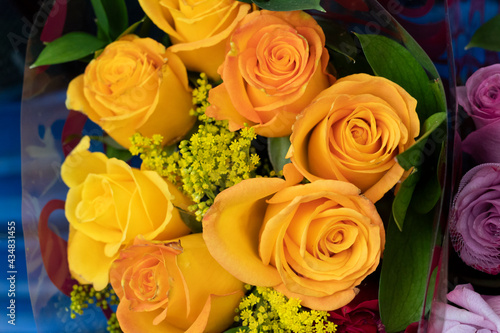 Closeup to a yellow and pink roses  bouquet at floewrshop