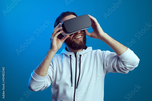 Young man using virtual reality headset. VR, future, gadgets, technology © Davidovici