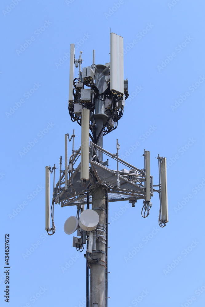 Telecommunications tower with a blue sky background