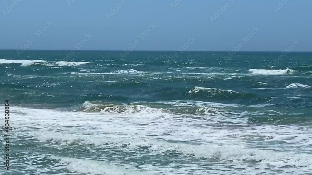 Not strong sea storm - sea waves crash on the rocks of the coast. HD Not strong sea storm - sea waves crash on the rocks of the coast. HD