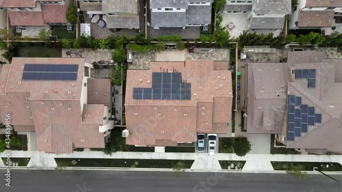 Wallpaper Mural Tustin houses with solar panels on roof, California. Aerial top-down ascending Torontodigital.ca