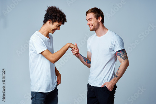 two friends holding hands positive isolated background