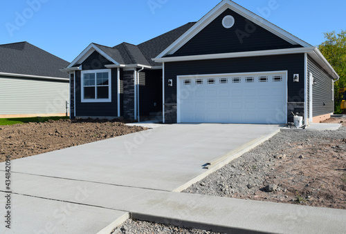 New Home Driveway Construction with a Concrete Cement Foundation by Builders for a Smooth Surface photo