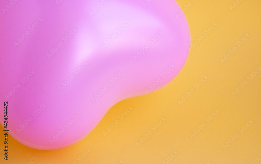 Pink balloon in the shape of a heart on a yellow background. Wedding concept, Valentine's Day, photo zone, lovers. Banner. top view. Pink balloon in the shape of a heart on a yellow background. Wedding concept, Valentine's Day, photo zone, lovers. Banner. top view.