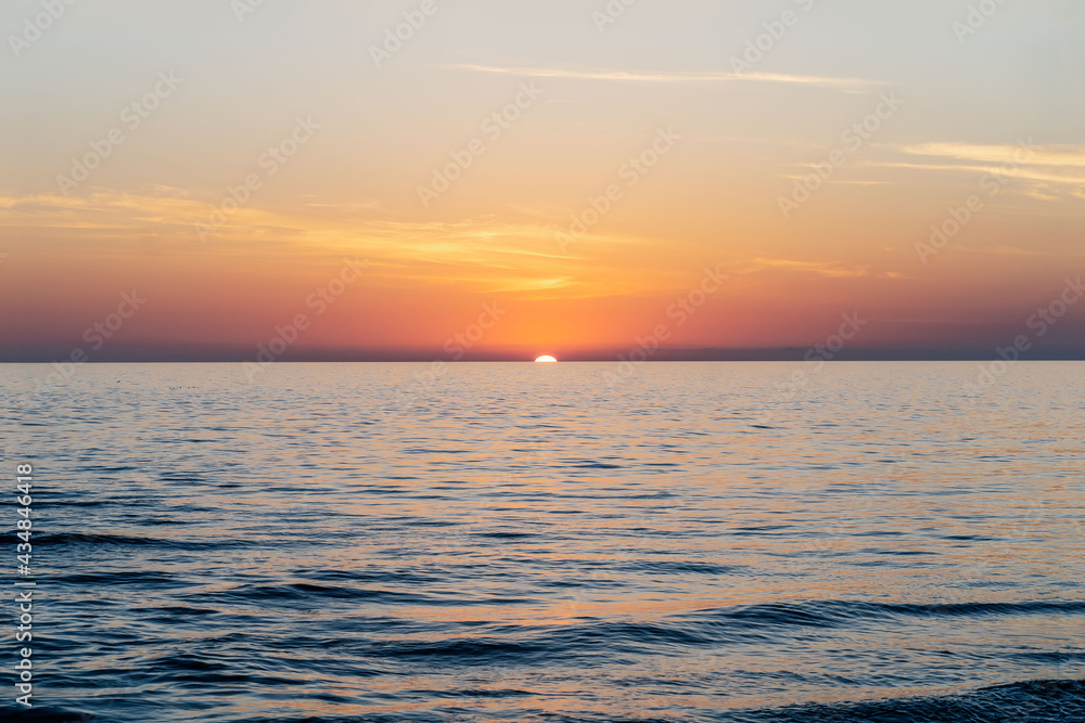 Beautiful sunset landscape on the blue sea.