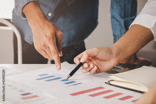 Quadro em tela Discussion, Brainstorm asian young businessman, businesswoman are analyzing charts, graph on document, discussing economic strategy on paperwork for companies to growth on table at office, workplace