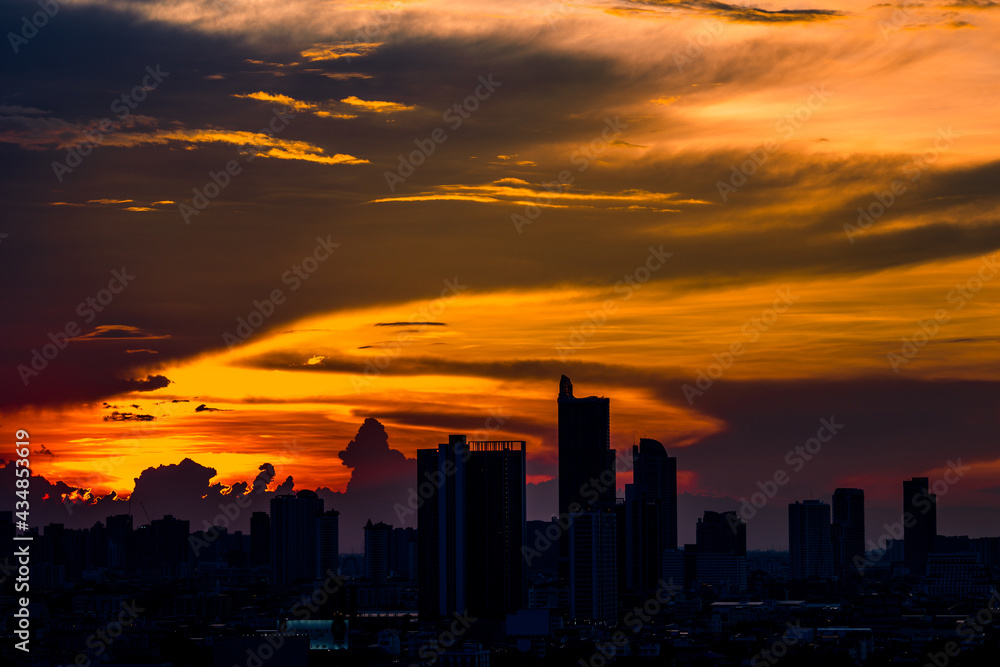 The high angle background of the city view with the secret light of the evening, blurring of night lights, showing the distribution of condominiums, dense homes in the capital community