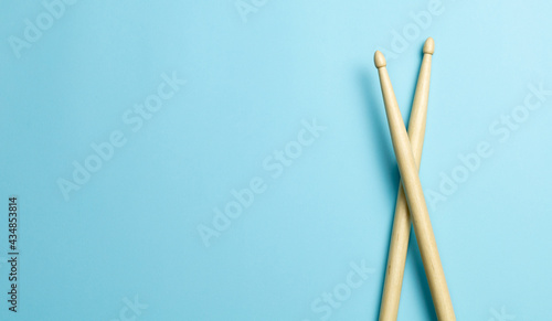 Drum sticks on a blue background. Template Copy space for text © adragan