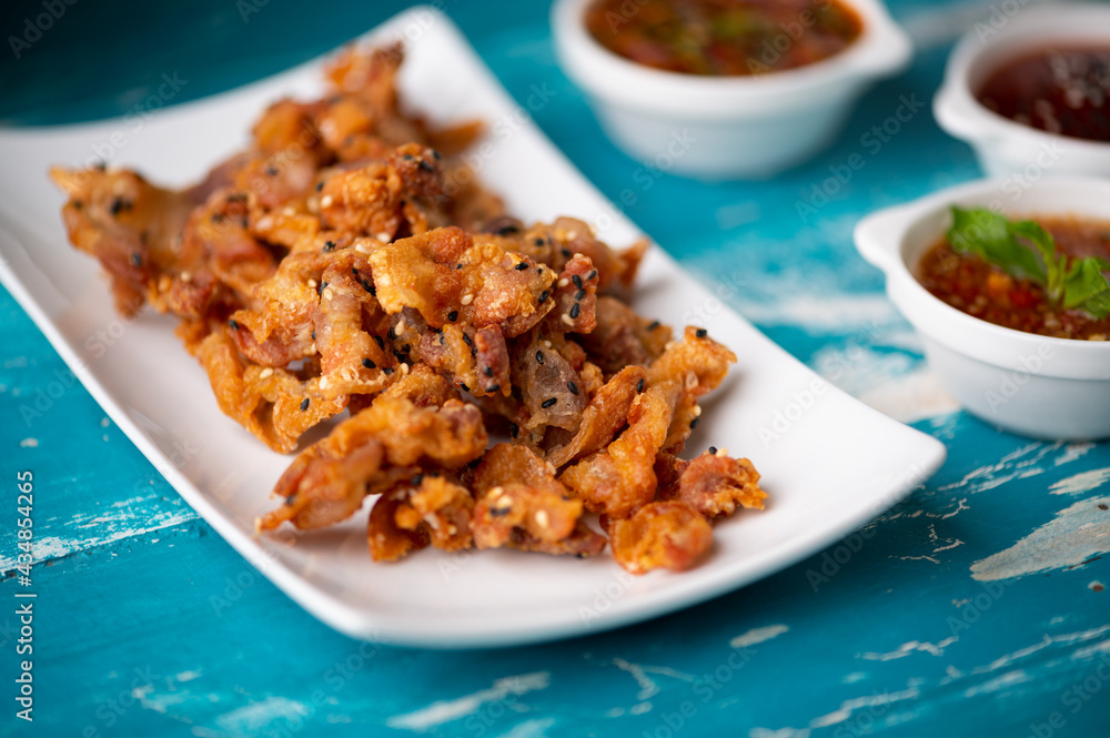 Crispy fried sliced belly pork with spicy sauce Crispy fried sliced belly pork with spicy sauce