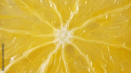 Macro Shot of Slice Orange Fruit and Rotate. Closeup Fresh Citrus Orange. Healthy Food Background. Slow Motion. High quality 4k footage