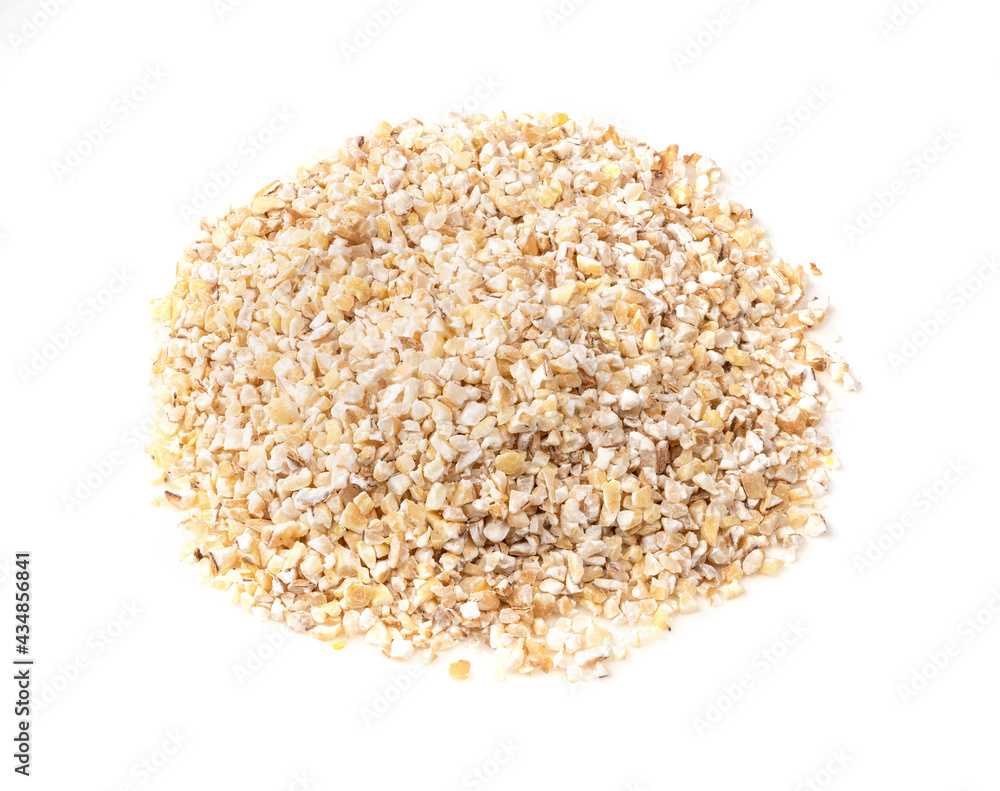pile of crushed pot barley groats closeup on white pile of crushed pot barley groats closeup on white