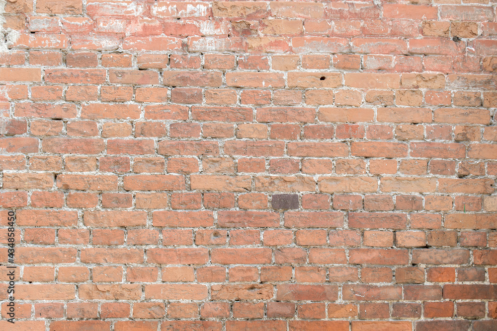 Old brick wall for a backdrop. White cement joints. The color of the bricks is pink, brown. Old brick wall for a backdrop. White cement joints. The color of the bricks is pink, brown.